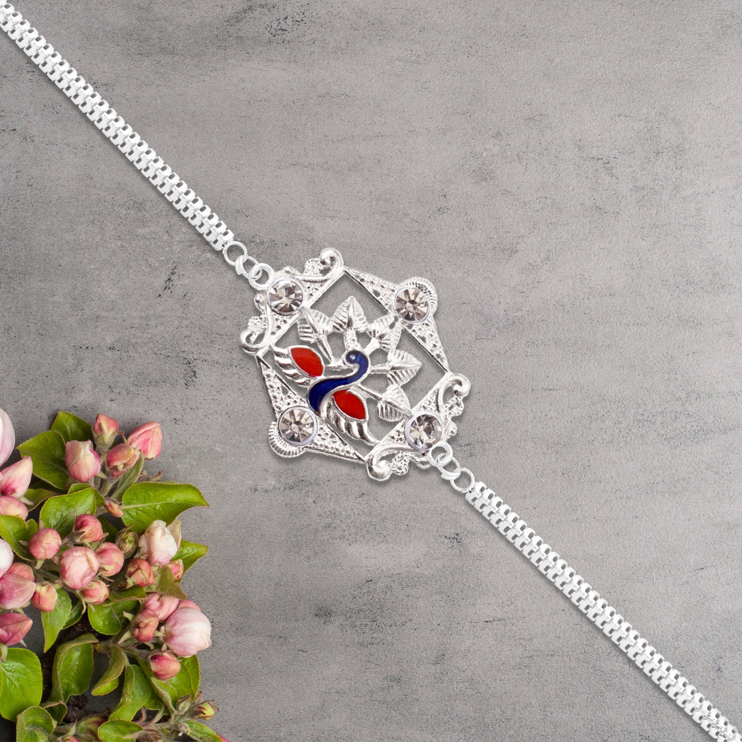Silver Peacock Rakhi With Diamond Accents Silver Peacock Rakhi With Diamond Accents